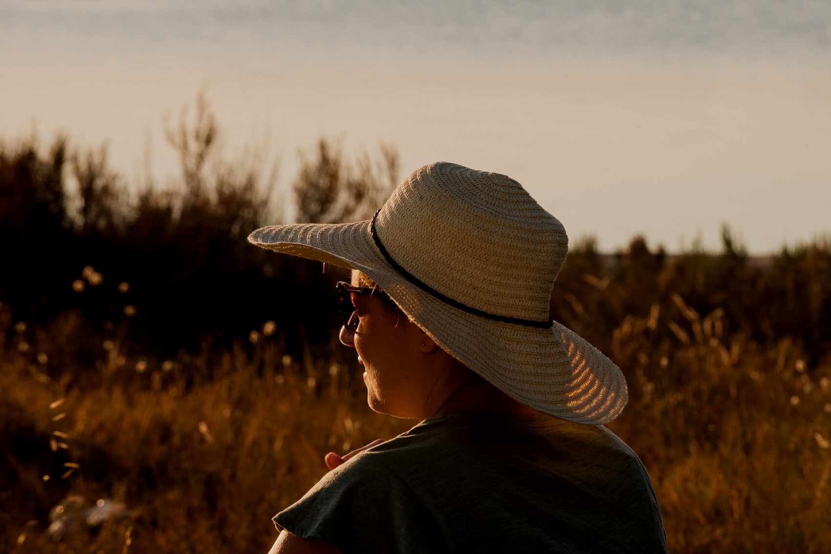 Woman Looking at the Scenery at Sunset